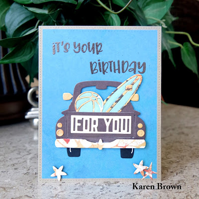 Spellbinder\'s Truckin\' Through the Seasons with surfboard and beach ball. Nuvo Tonic Hot Chocolate embossing powder