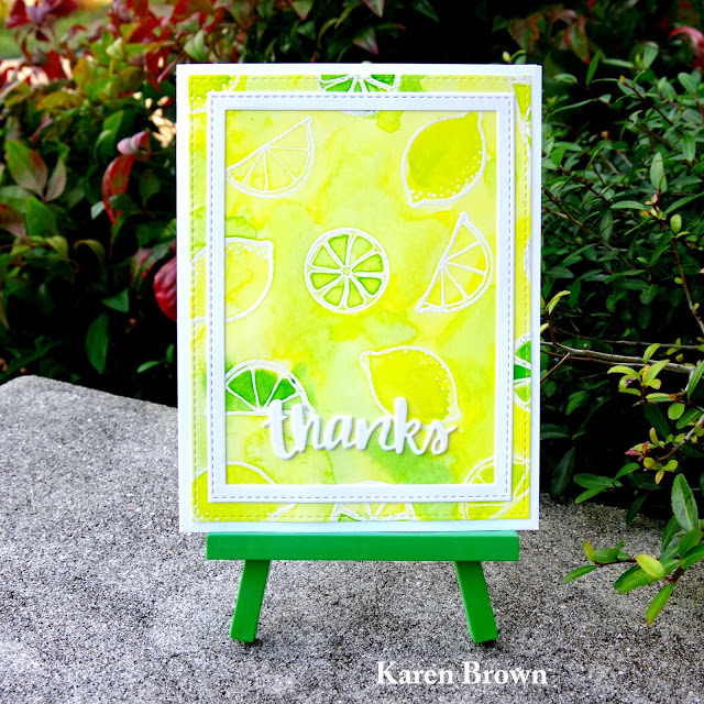 Watercolor stamped background in yellow and lime green.