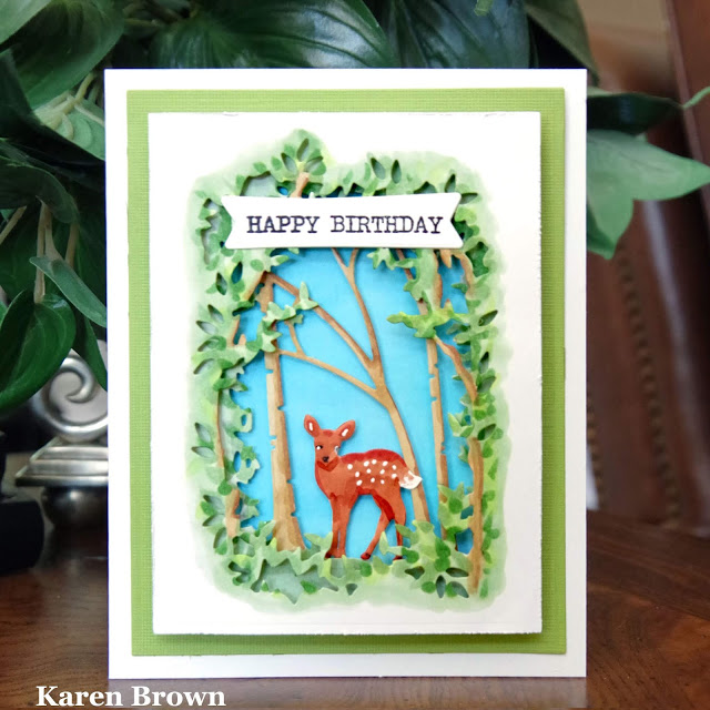 A Handmade Woodland Diorama card with forest and deer.