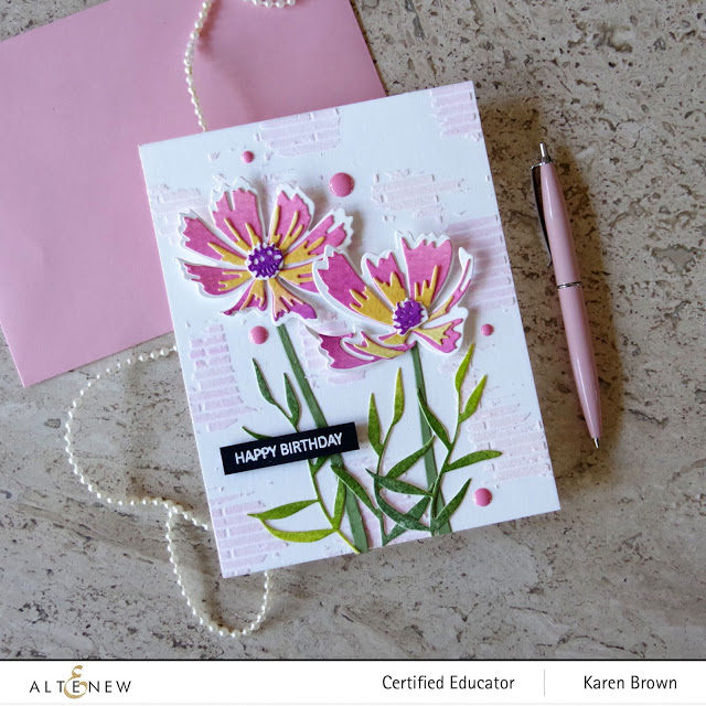 Altenew Cosmos Paint-A-Flower kit Pink die-cut flowers with mixed media background