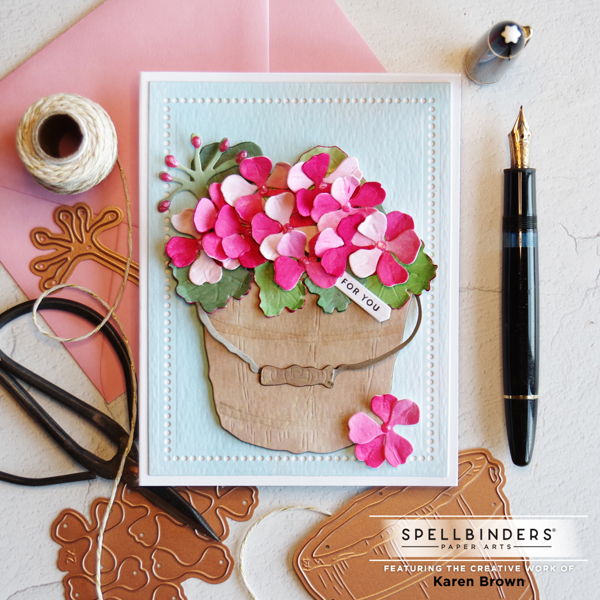 Die Cut Geranium card with hand crafted papers.