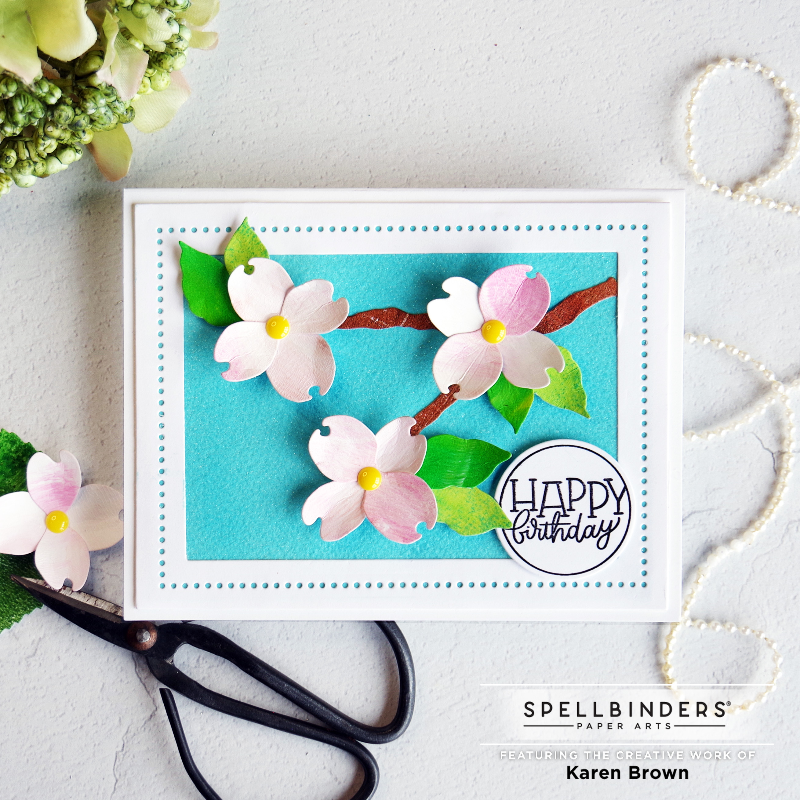 Die Cut Dogwood Blossom Card with DIY handmade glitter paper background.