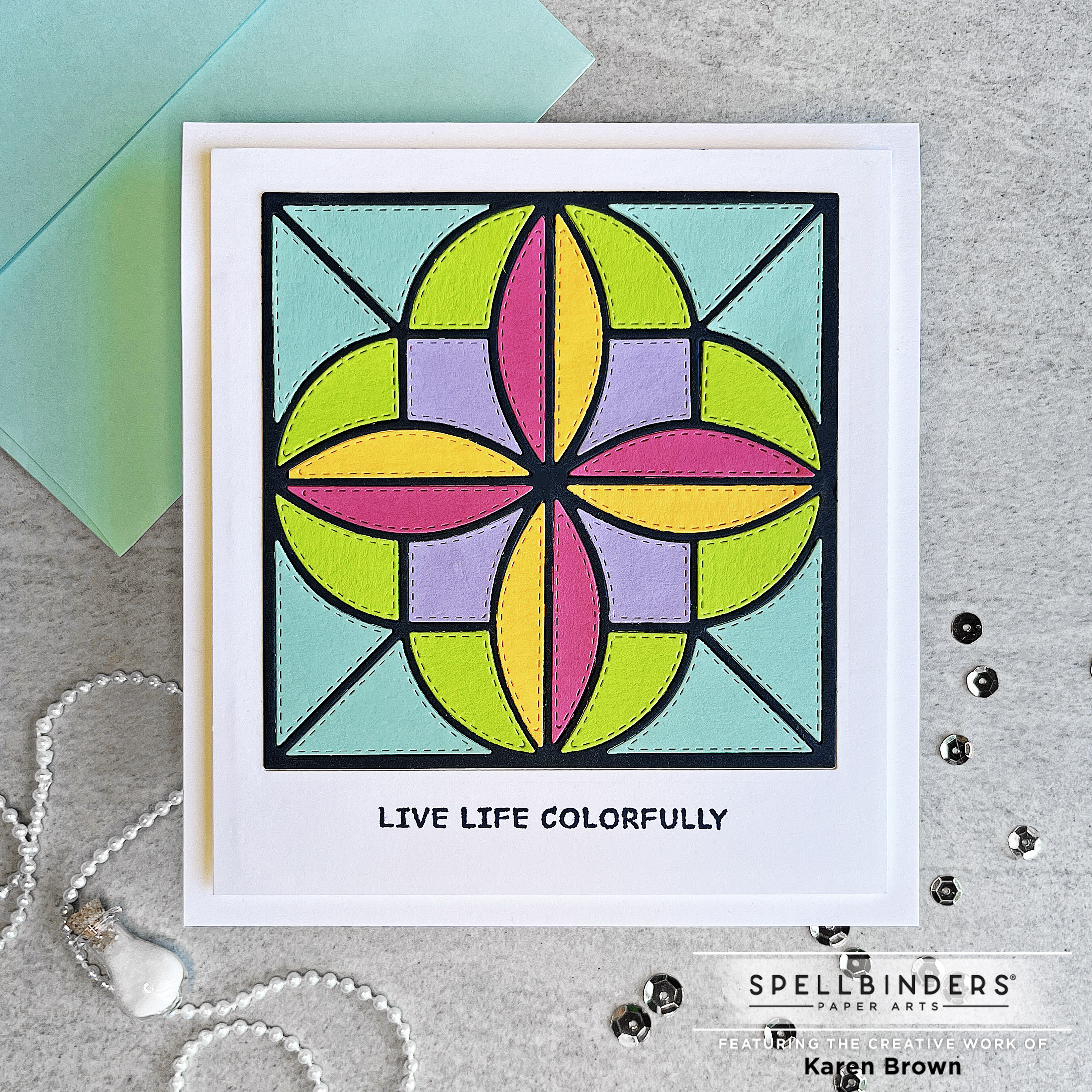 Achieving a stained glass effect with inlaid die cutting.  