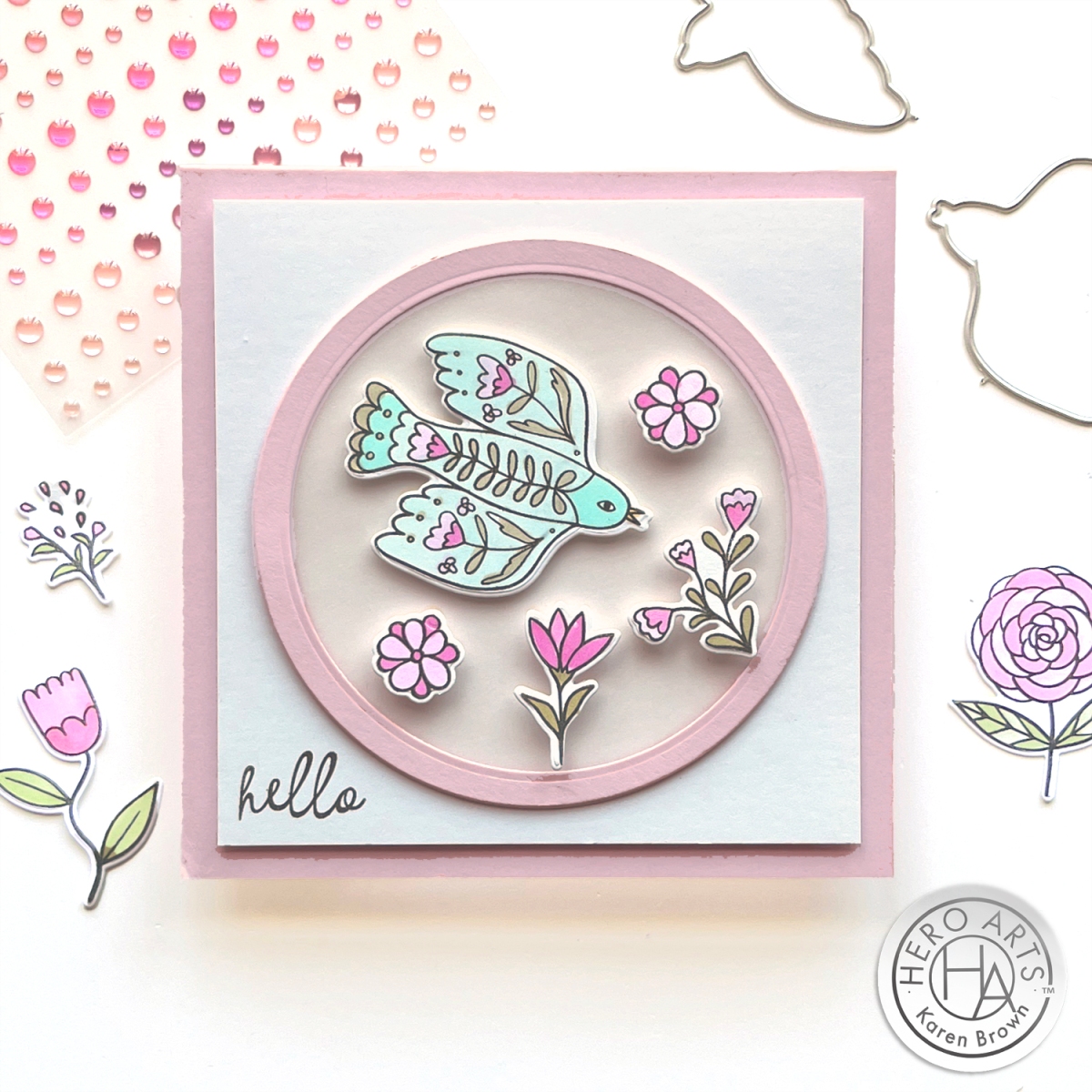 Charming Folk Art stamp and die cut scene with soaring bird and pink floral elements with a vellum insert.