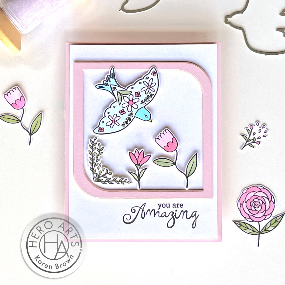 Folk Art stamped and die cut floral scene card  with a soaring bird in pink, aqua and white.