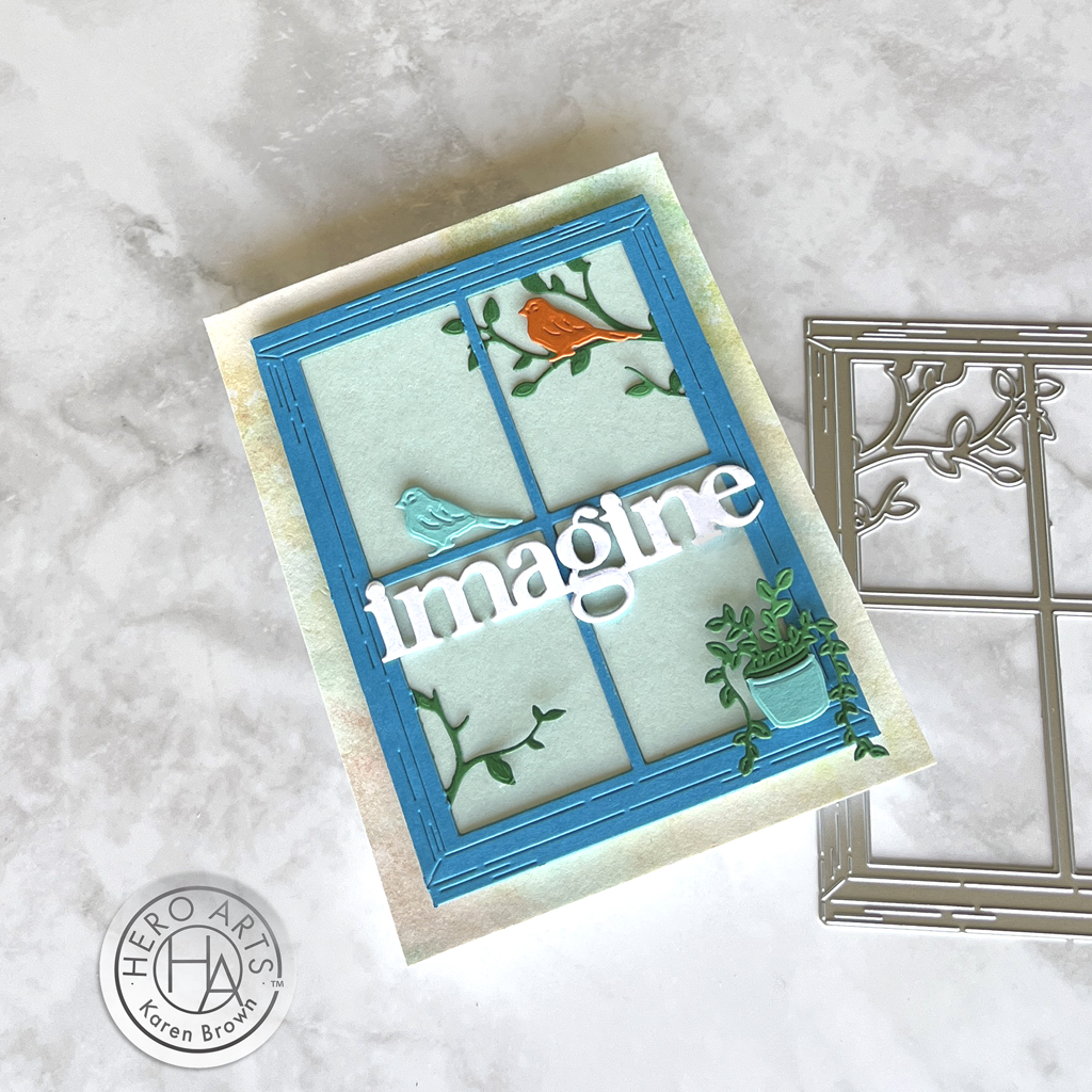 A charming handmade card window scene with birds, tree branches and a potted plant.