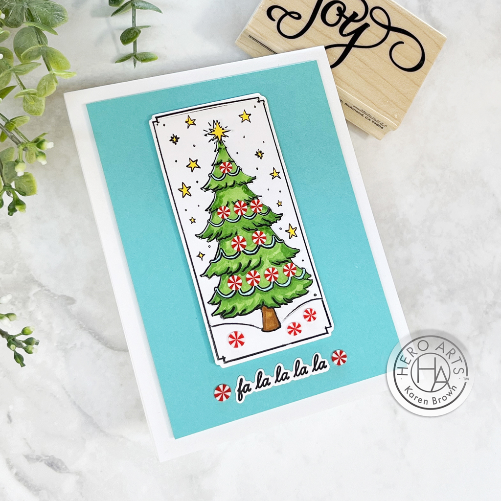 Stamped, colored and die cut handmade card featuring a Christmas card with pepperment candy embellishments.