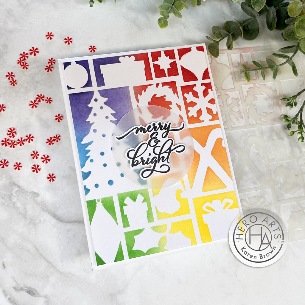 Rainbow stenciled Christmas card featuring Hero Studio's  Holiday Assortment Stencil and Holiday Messages sentiment.
