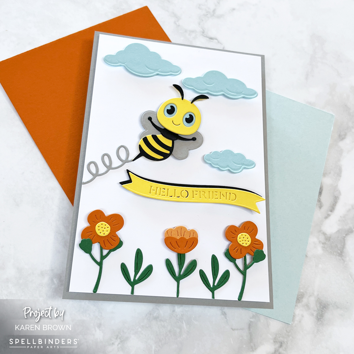 Creating an adorable die cut handmade bumblebee Hello Friend with dancing flowers.