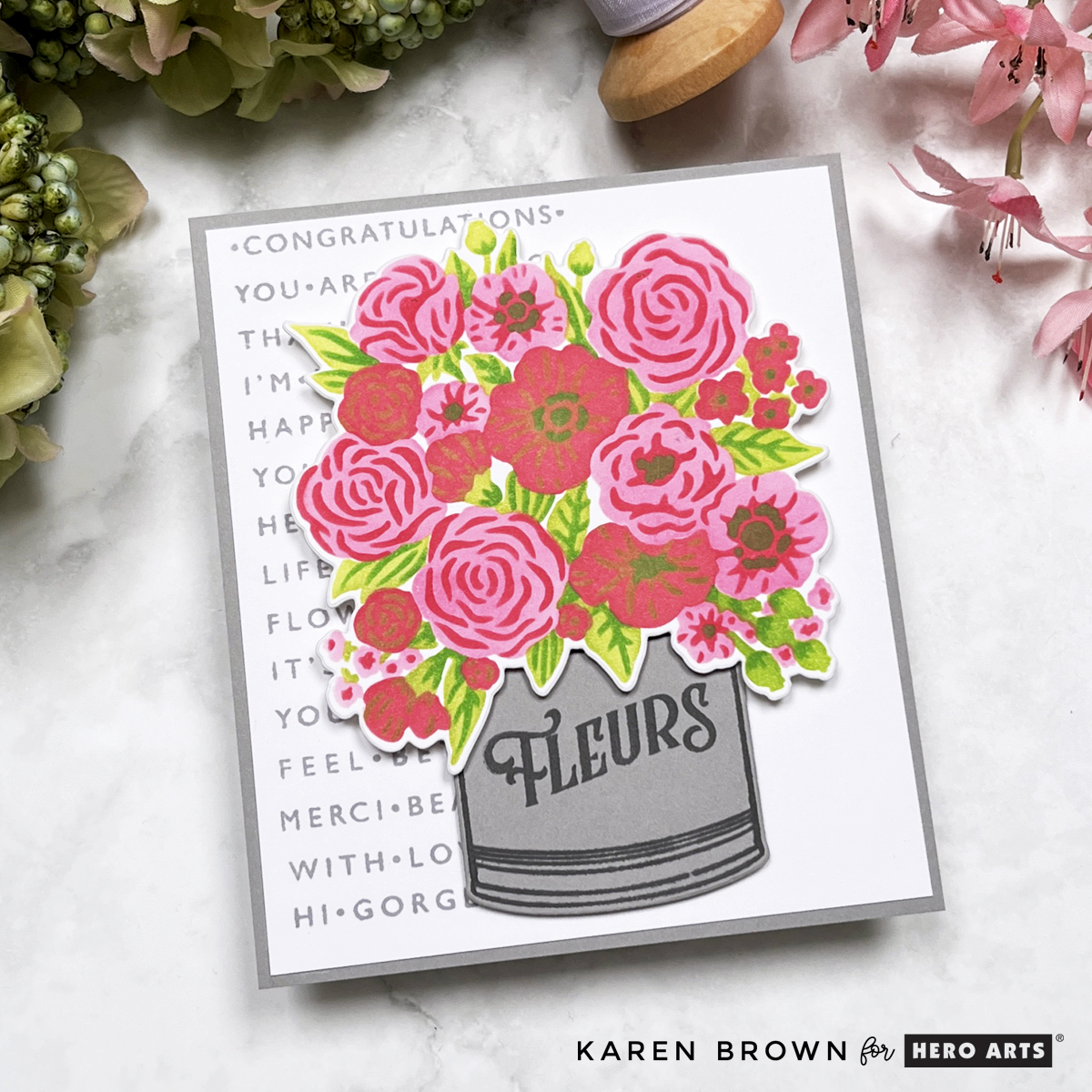 Lovely pink layering stenciled and die cut floral card with a stamped sentiment strip background that is perfect for Mother's Day, Birthday or Get Well cards.