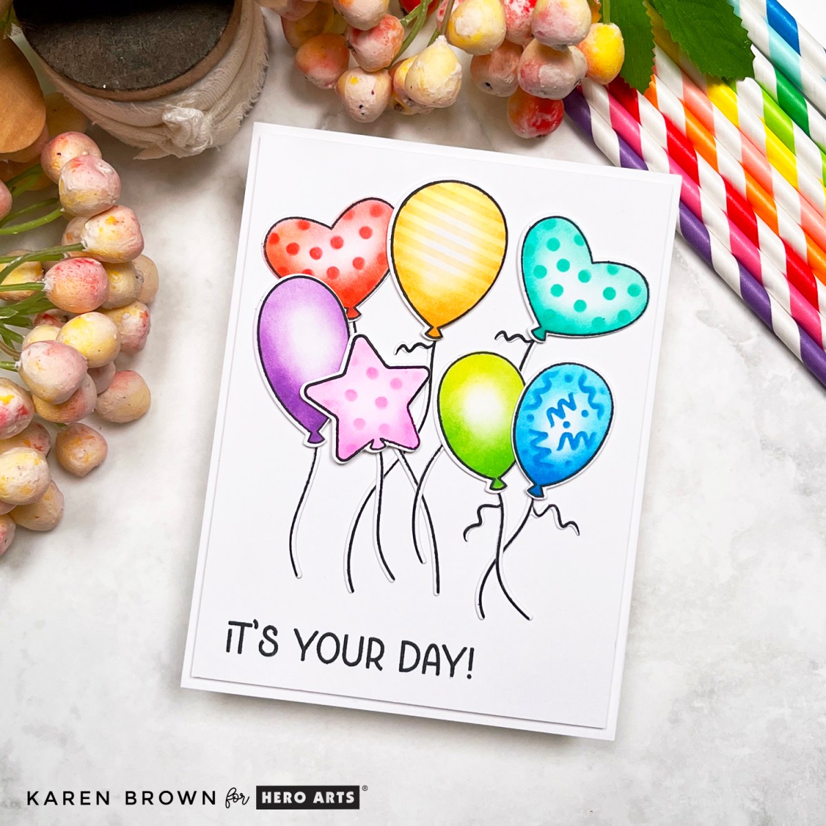 Festive rainbow hued balloon card featuring Hero Arts Balloons stamp, cover plate die and layering stencils.  CM790, DF241, SA299.