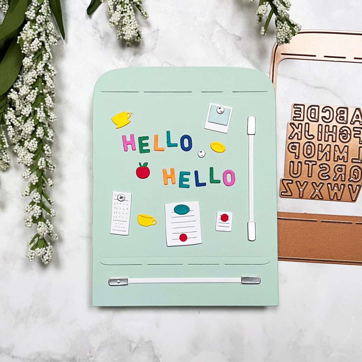 Spellbinders Large Die of the Month  card featuring a die cut retro fridge in mint green with lots of refrigerator magnets, grocery lists etc.