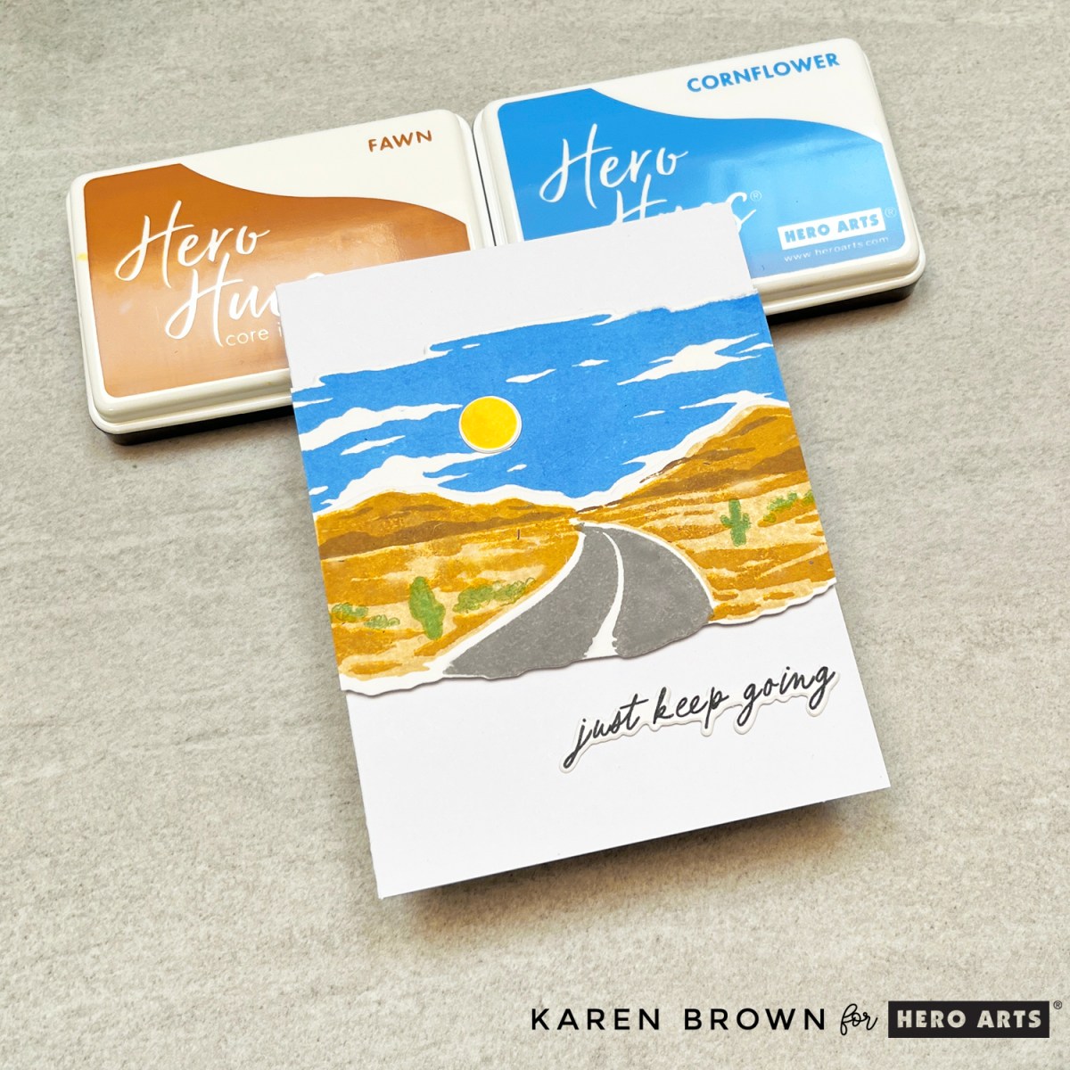 Layer stamp Heroscape of a winding road through the desert mountains from the July 2025 Hero Studio Card Kit of the Month.