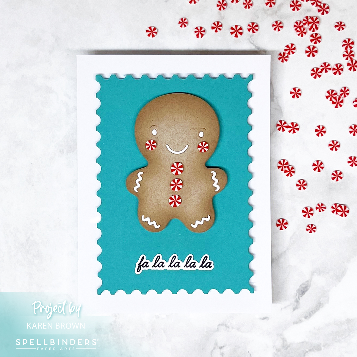 A die cut gingerbread man with white icing and peppermint cheeks/buttons, layered over a teal nesting postage stamp background and mounted on a white card base. Sentiment reads 'Falalalala.'