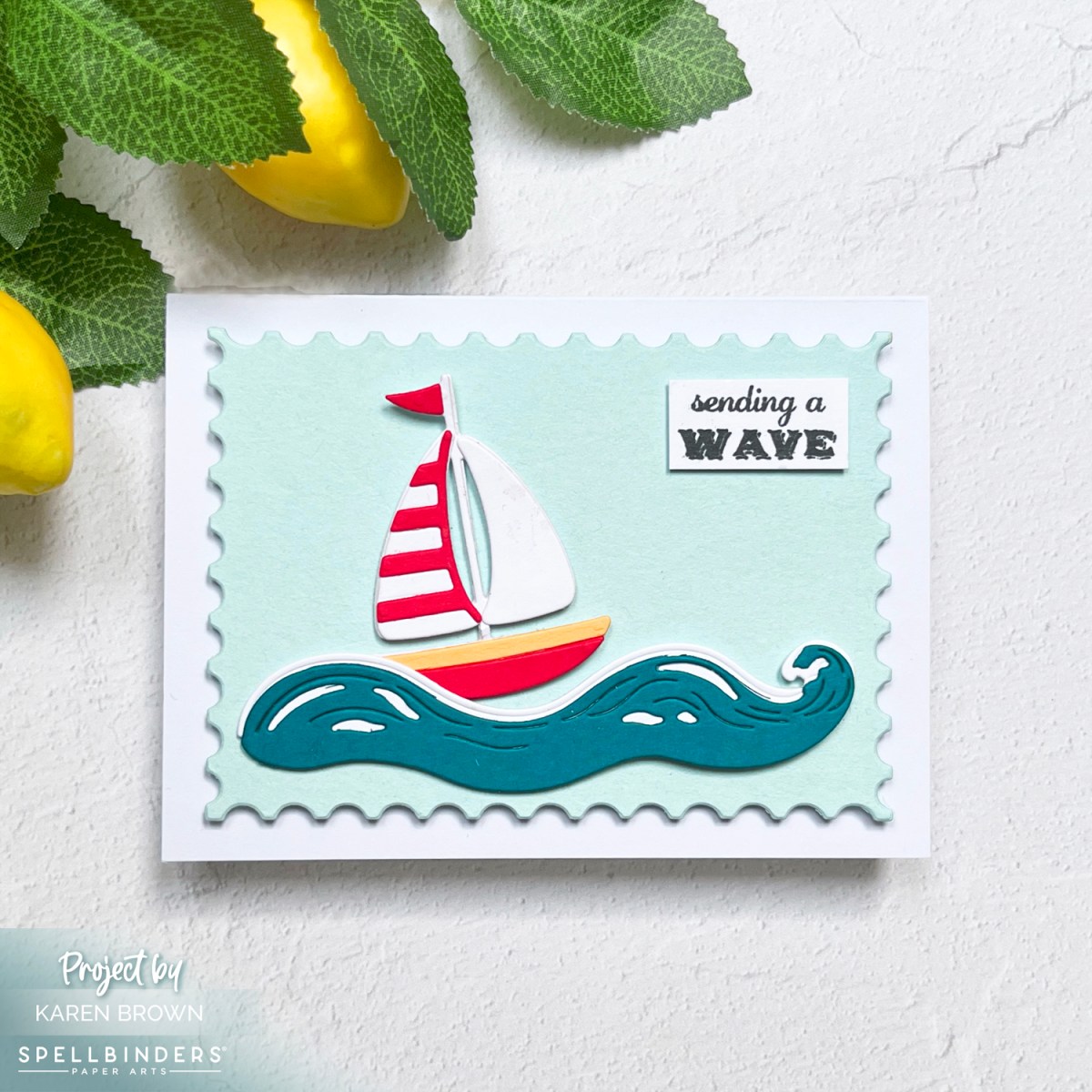 Adorable die cut sailboat note card with a "sending a wave" sentiment using the June 2025 Spellbinder bonus gift from the Deluxe Caboodle.