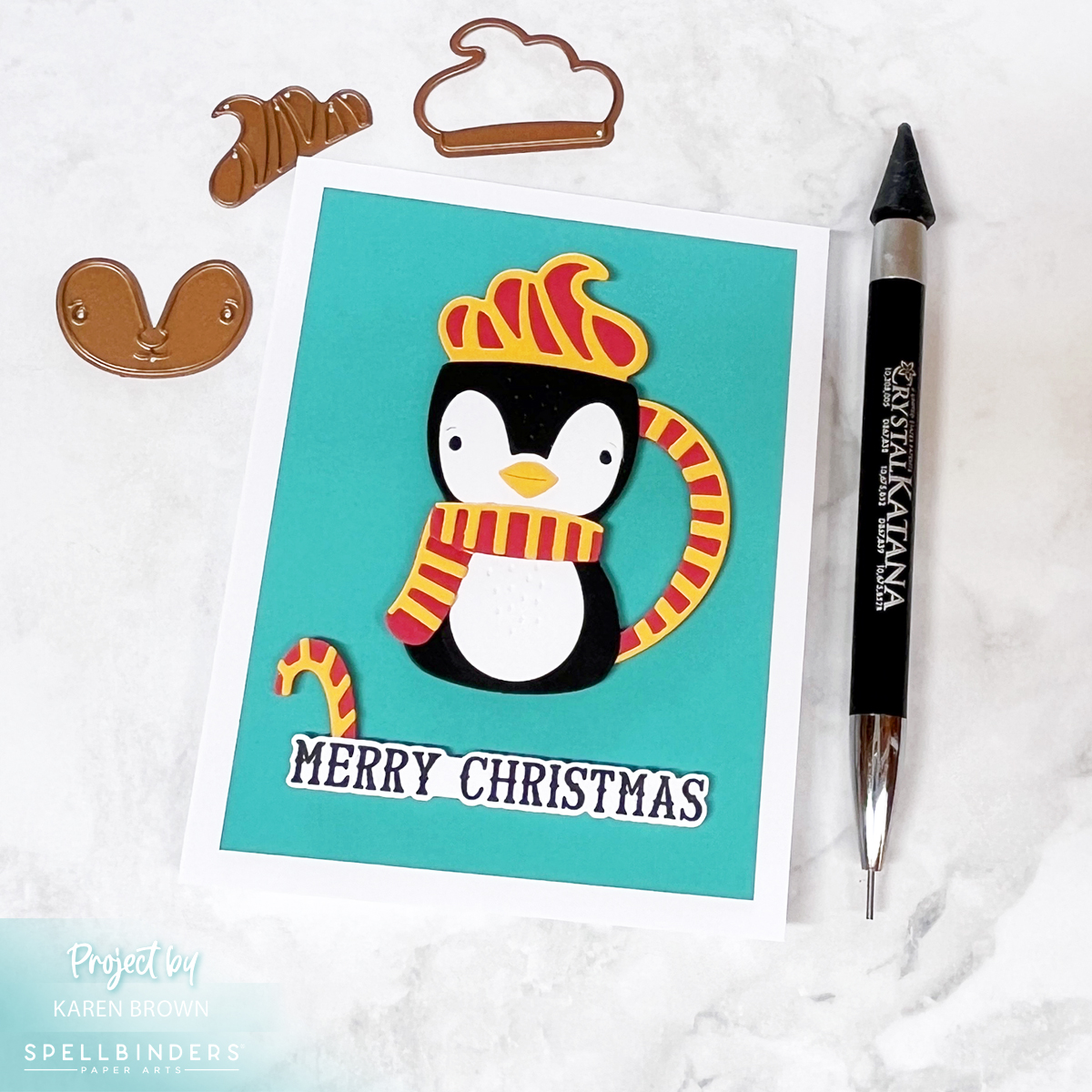 A bold, graphic card featuring a die cut penguin mug with whipped cream on a vibrant Teal Topaz background, accented with hot pink and yellow. 'Merry Christmas' sentiment adds festive cheer