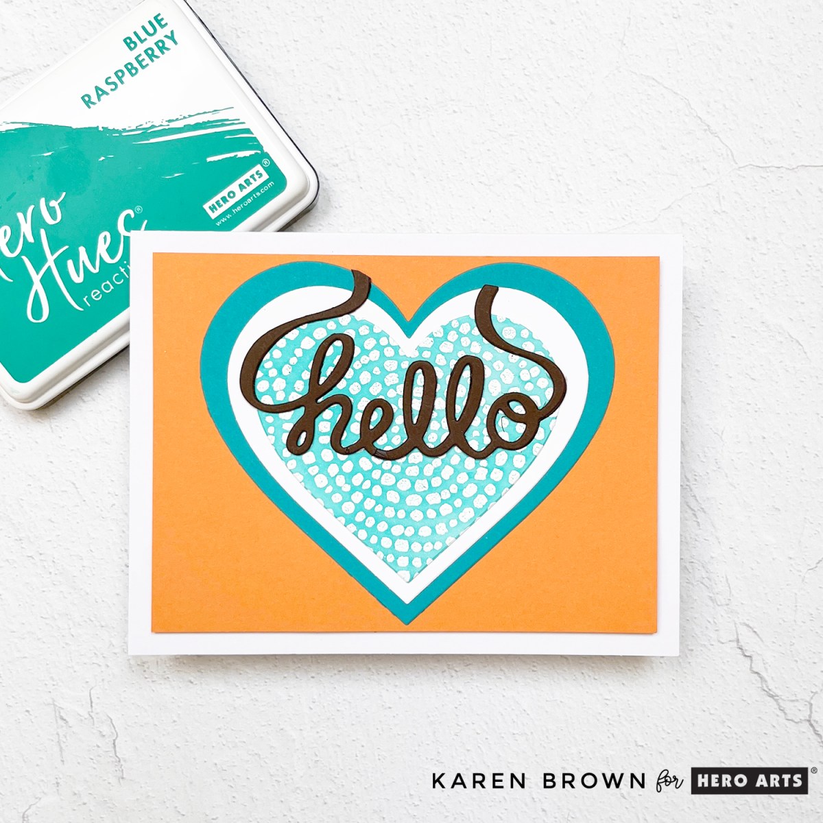 Bright summery hello card with layered die cut hearts, scripty hello sentiment, and turquoise, white and orange color palette.  