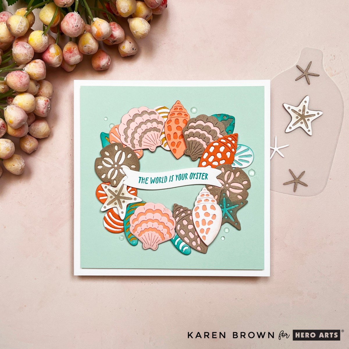 Square handmade card with pastel beach shell wreath die cuts in mint, coral, blush, kraft, white and aqua.