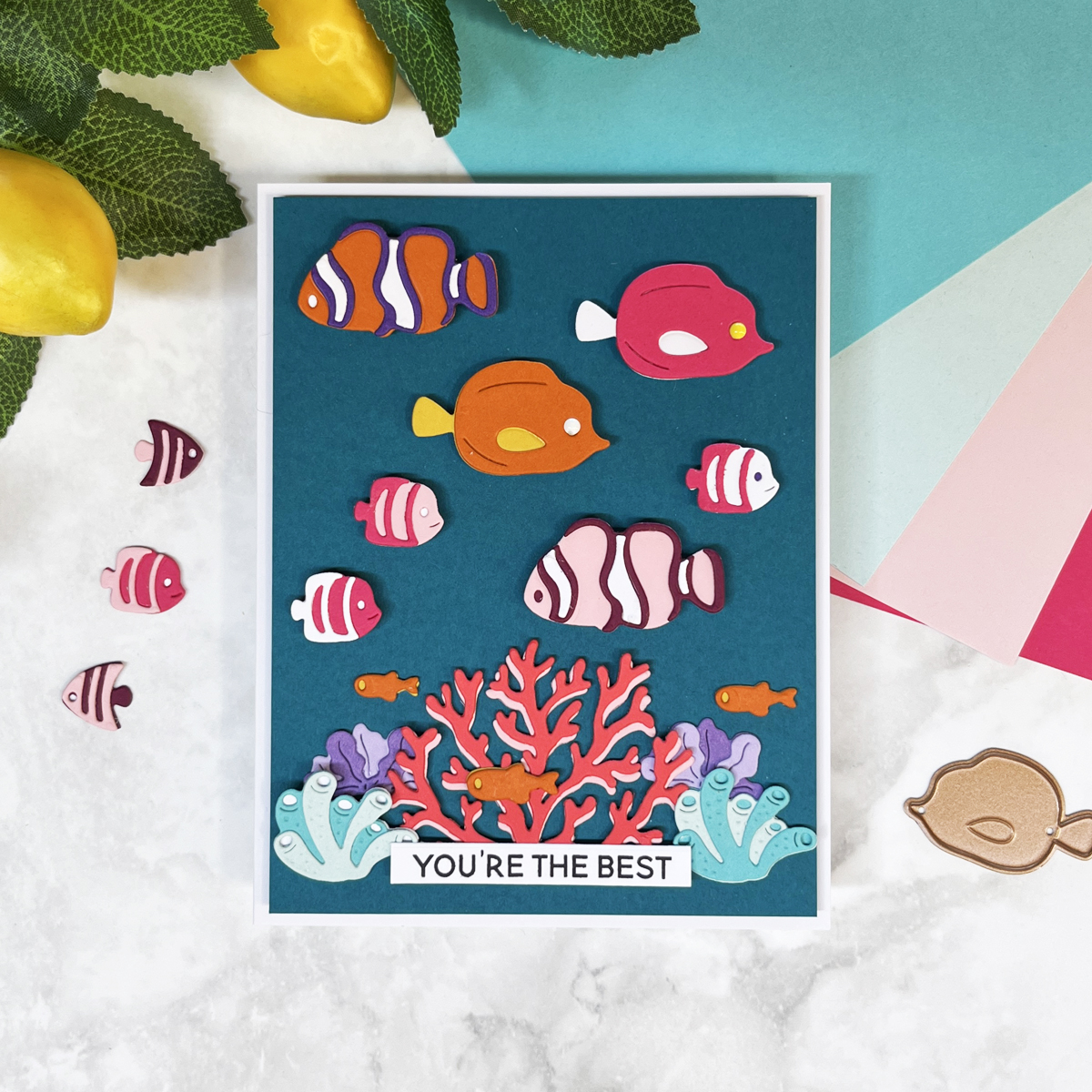 Die cut coral reef scene with colorful fish on Oceanside blue background. Made with Spellbinders August 2025 Die of the Month and Caboodle Bonus.