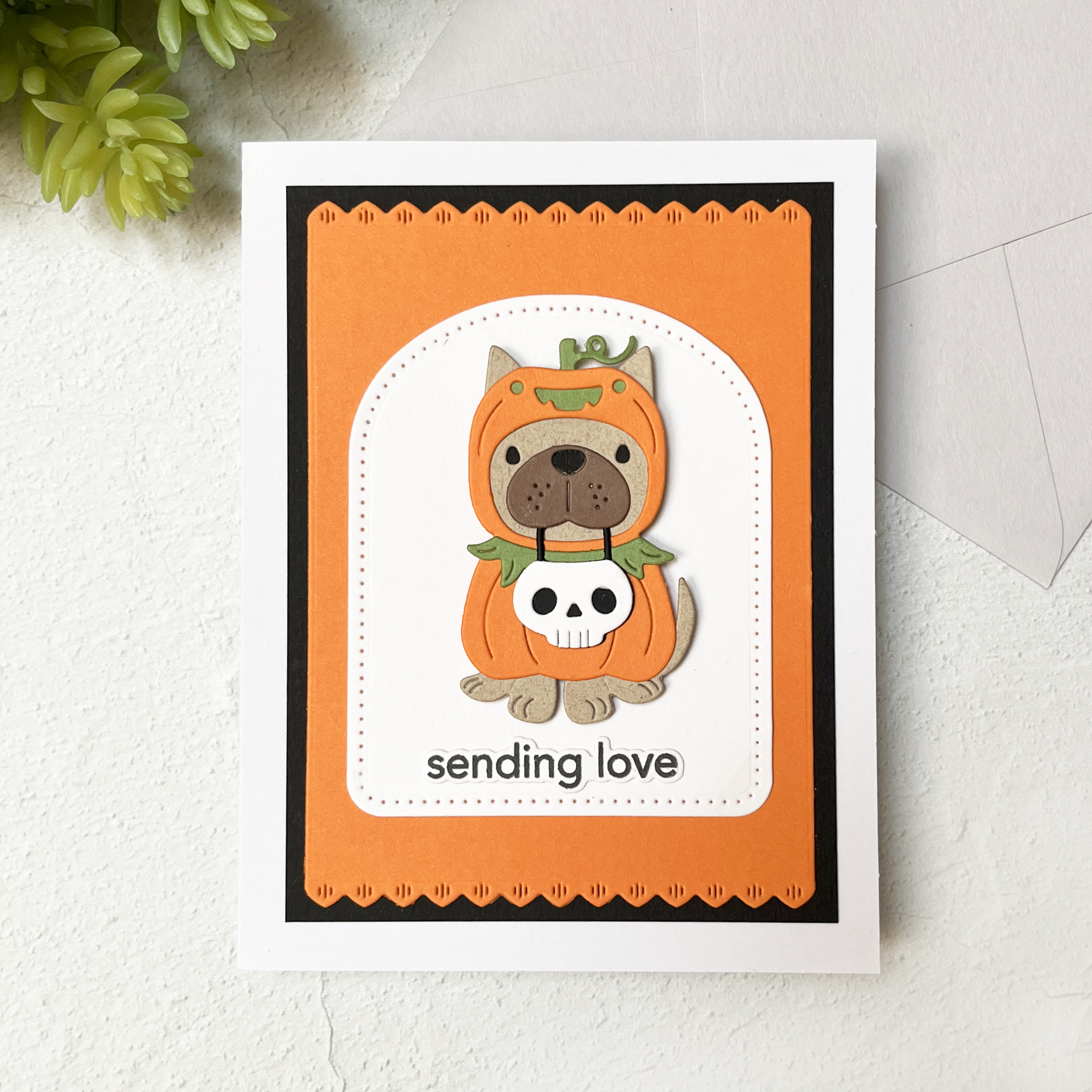 Adorable Pupkin (Dog in a Pumpkin Costume) die cut Halloween Card.