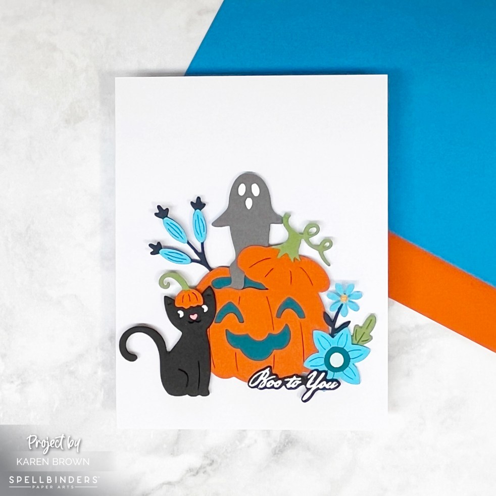 Die cut handmade Halloween Card with pumpkin, ghost and black cat.