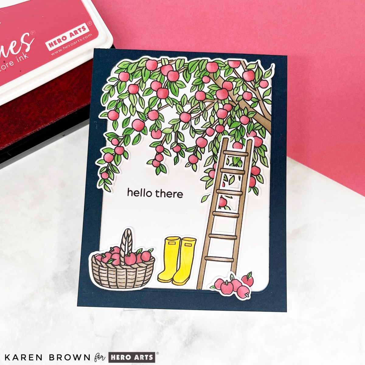 Hero Arts In the Orchard stamped, stenciled and die cut scene card featuring picking apples in an orchard.