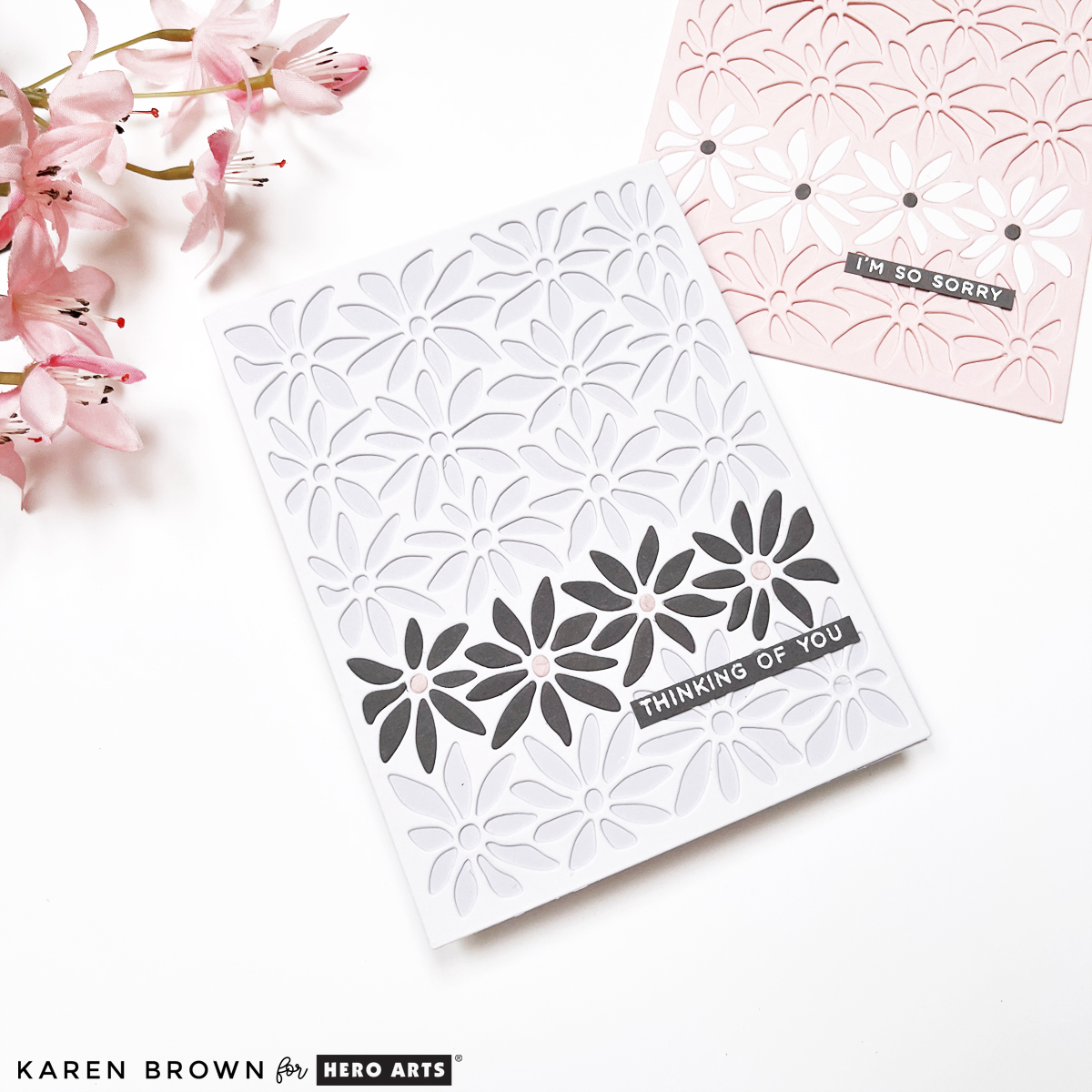 Handmade sympathy card using partial inlay die cutting with a single row of gray daisies and a pre-made sentiment strip for a thoughtful, understated finish.