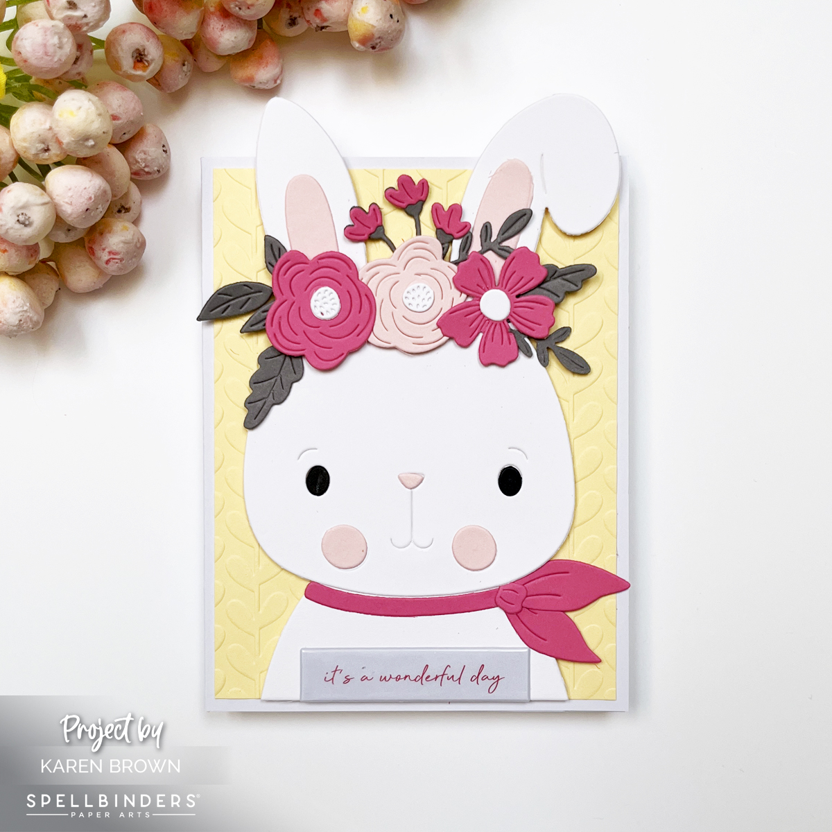 Close-up of bunny die cut from Spellbinders Large Die of the Month Club Kit Spring Specs showing layered flowers, gray leaves, and peeking bunny ears.