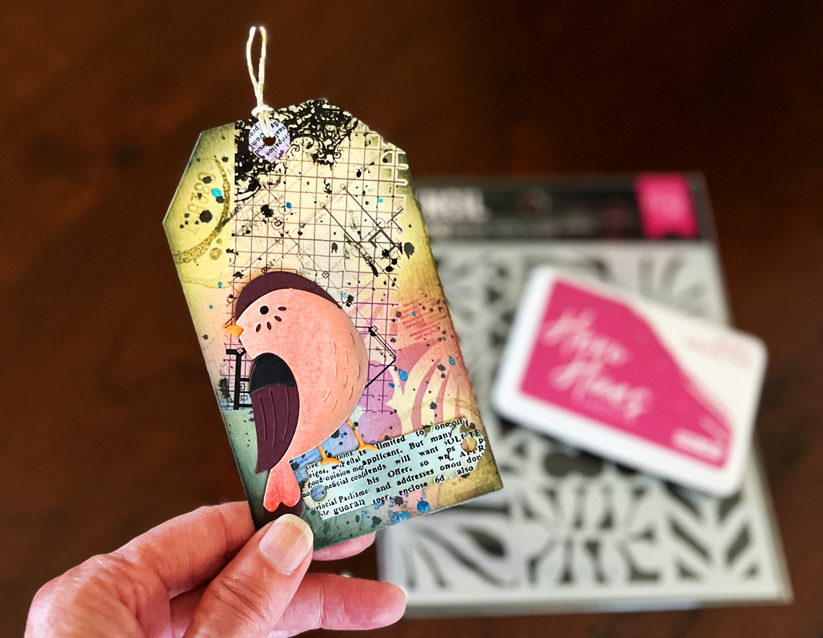 Finished mixed media tag with 7 layers + a die cut bird focal point.