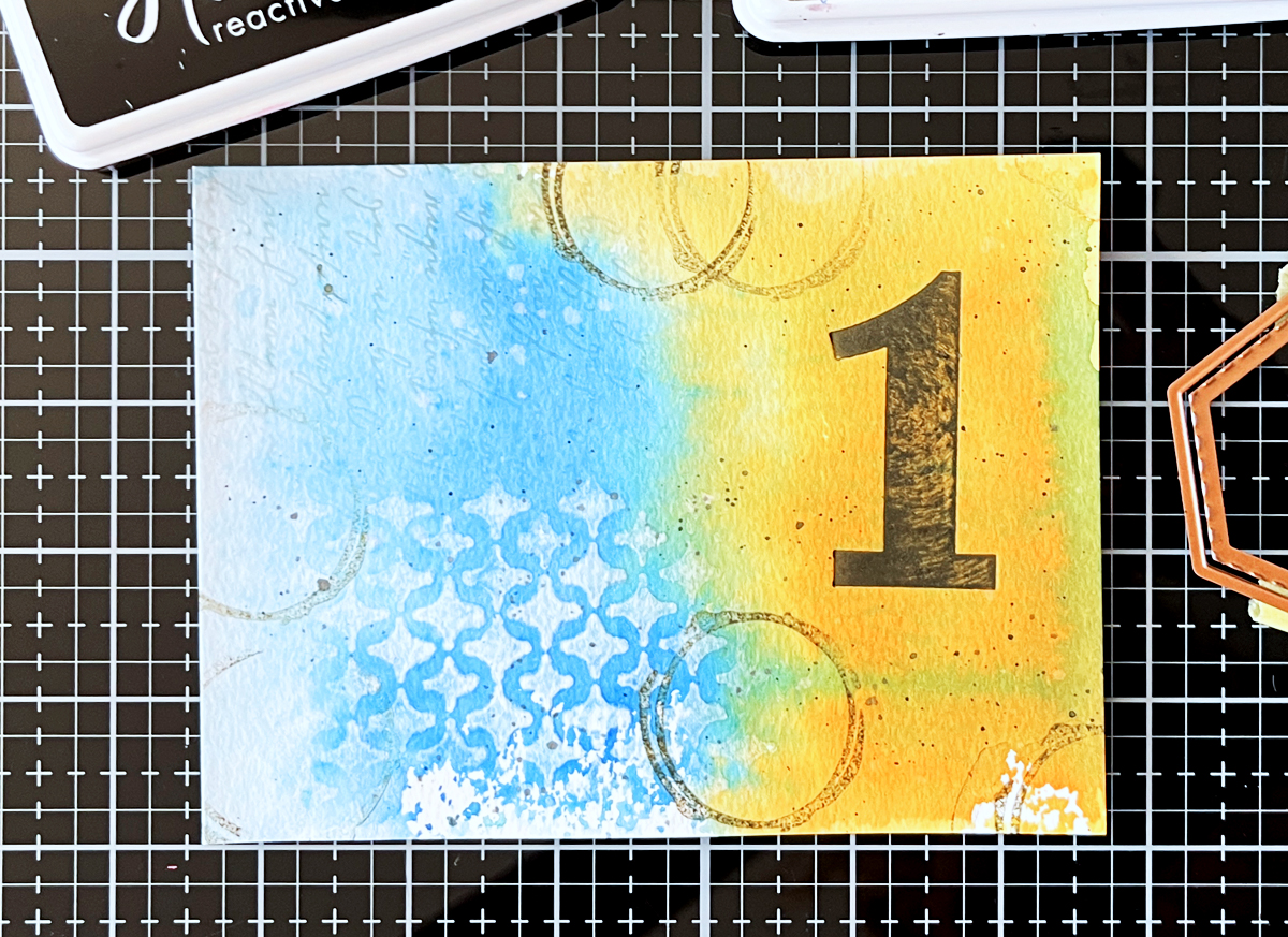 Mixed Media Background panel with addtional layers: BetterPress Number (Bold Color Mix Numbers BP-243) using Licorice Reactive Ink,
Script stencil on about 20% of the card,Removed color through Sparkle Weave stencil using a baby wipe,Stamped coffee stains with Root Beer ink, 
Water splatters (blotted),
Black splatters