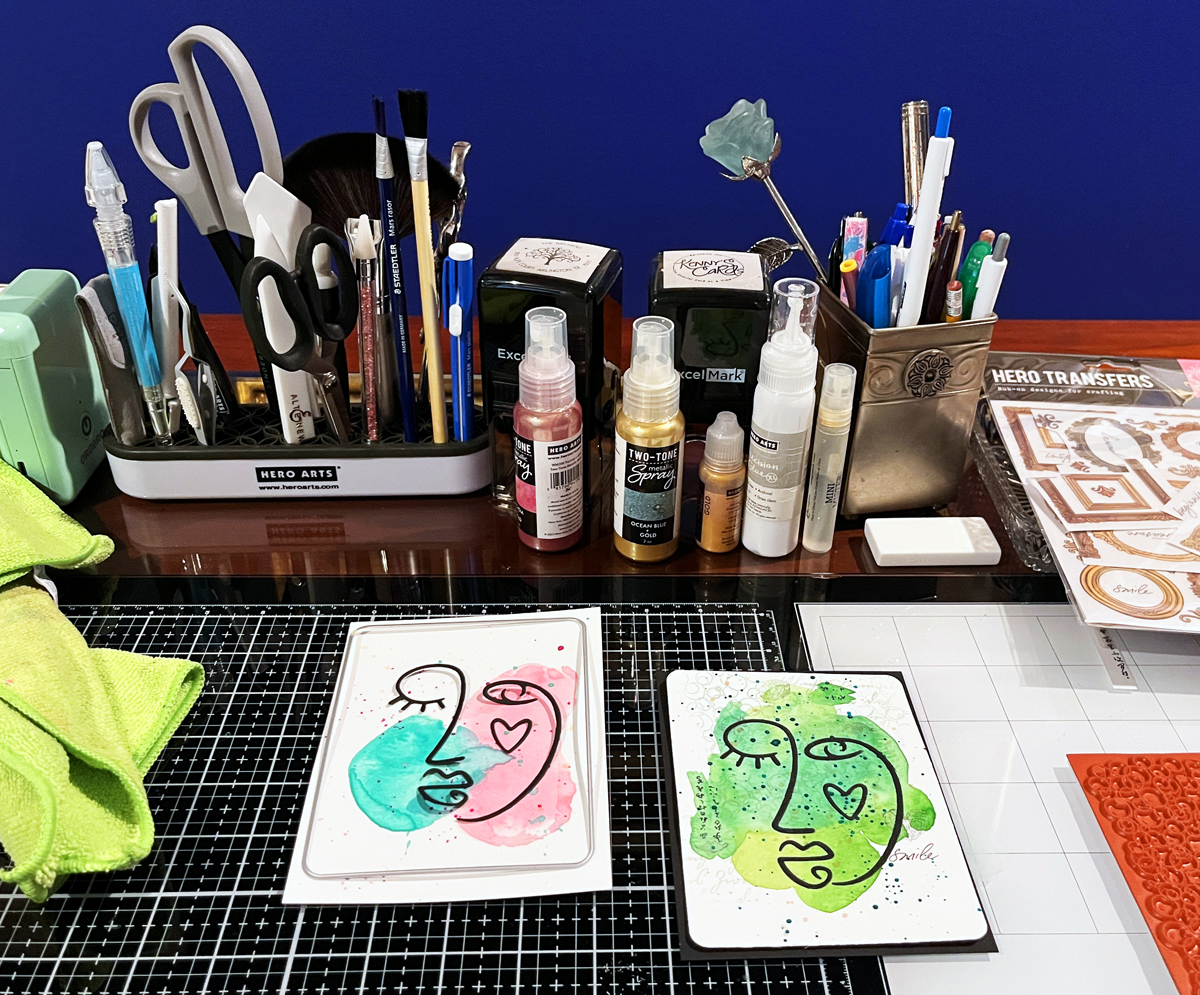 Watercolor backgrounds + splatters + black die cuts creates a bold modern mixed media look that works so well for cardmaking projects.