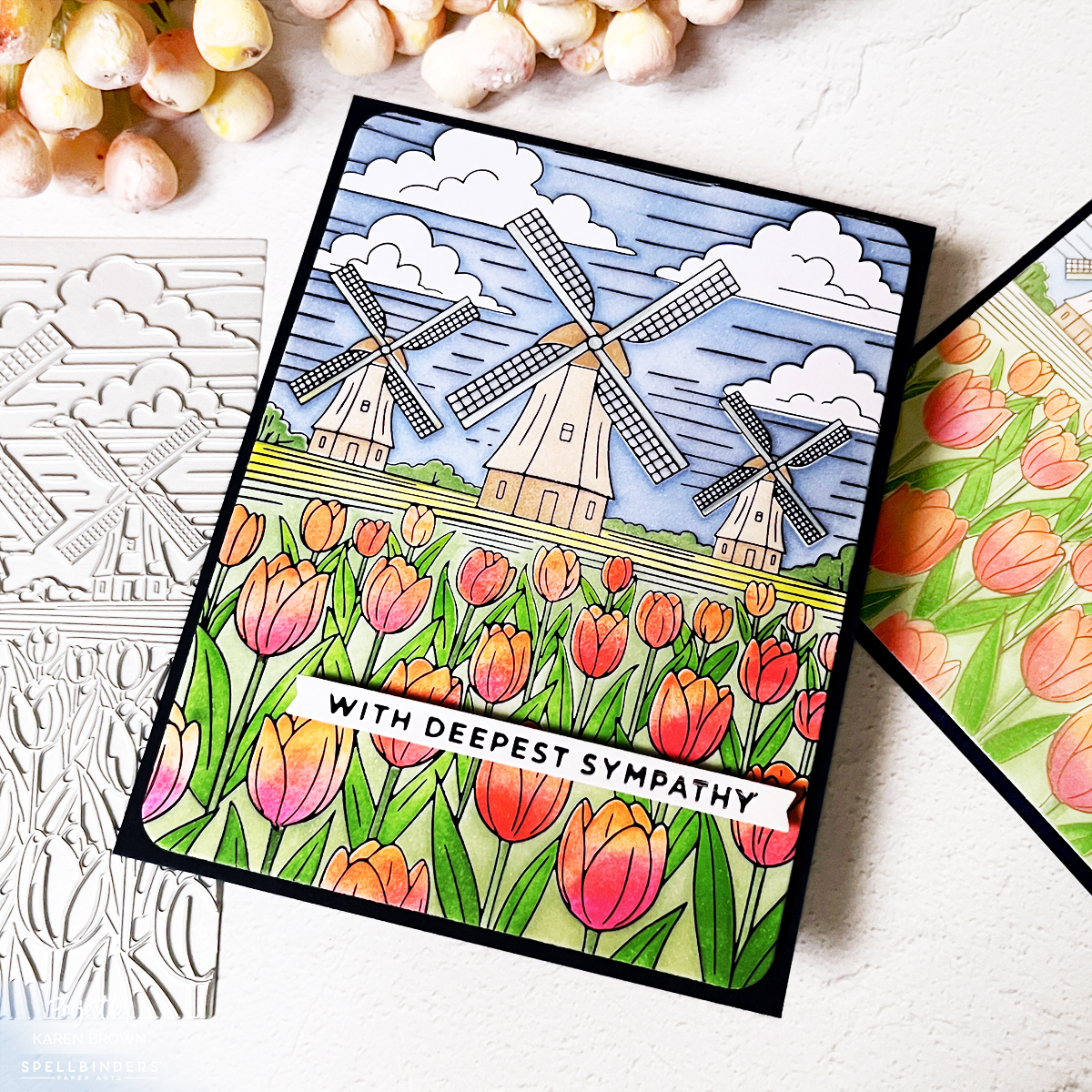 Black foil windmill and tulips card with vibrant pink, orange and blue ink blending mounted on blue A2 card base.