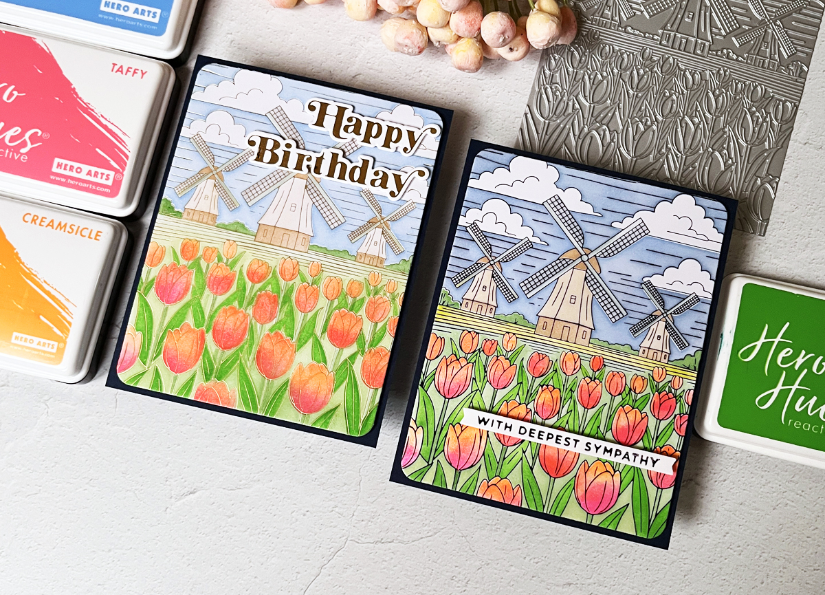 Side-by-side comparison of black foil and gold foil versions of Yana's Windmills & Tulips foiled (and colored with layering stencils) card.