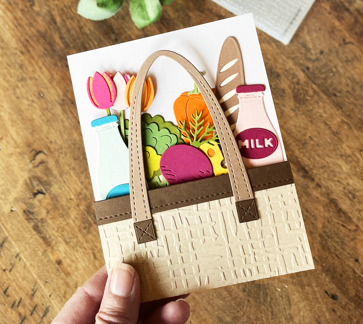 Die cut farmers market tote card using Spellbinders Large Die of the Month kit for April 2026.