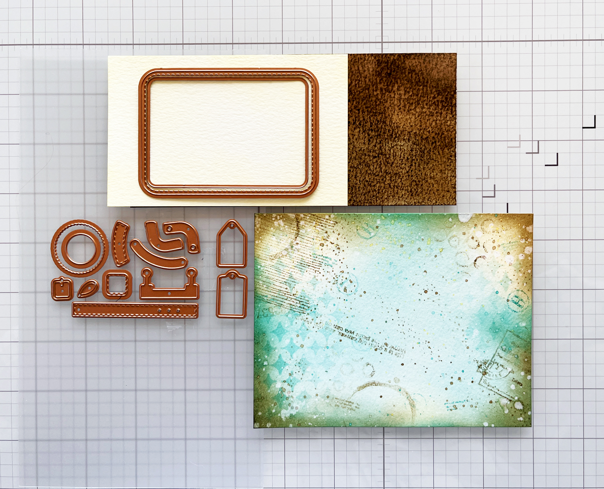 Die cutting a focal point for a layered mixed media background.