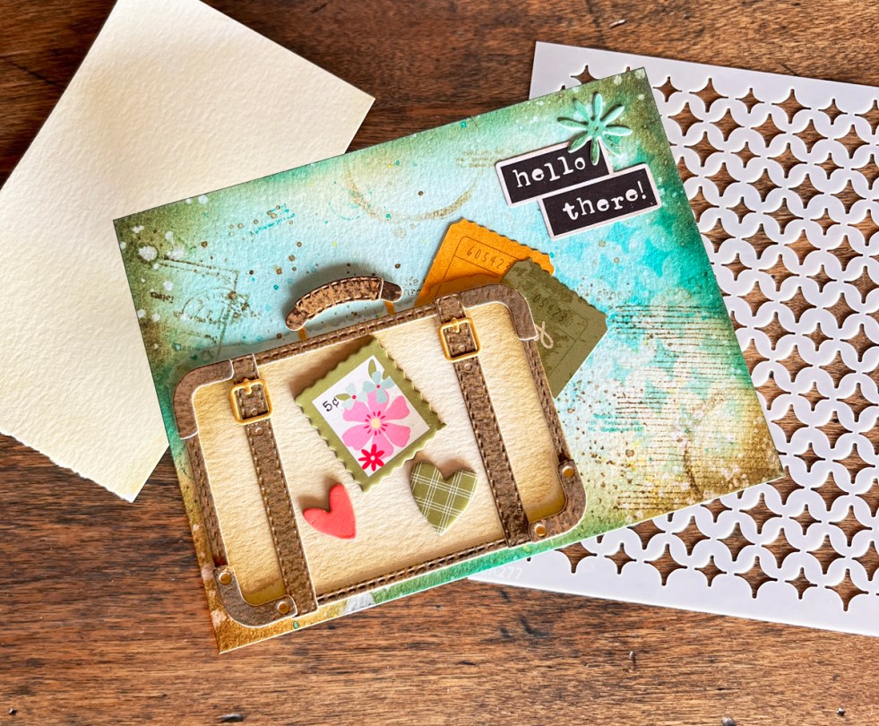 Mixed medai card with retro die cut suitcase and ink blend background.