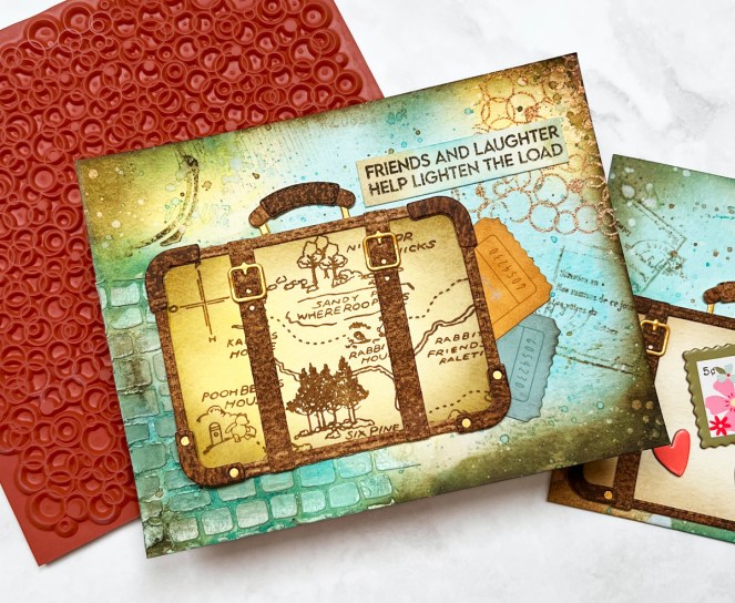 mixed media card with die cut suitcase.