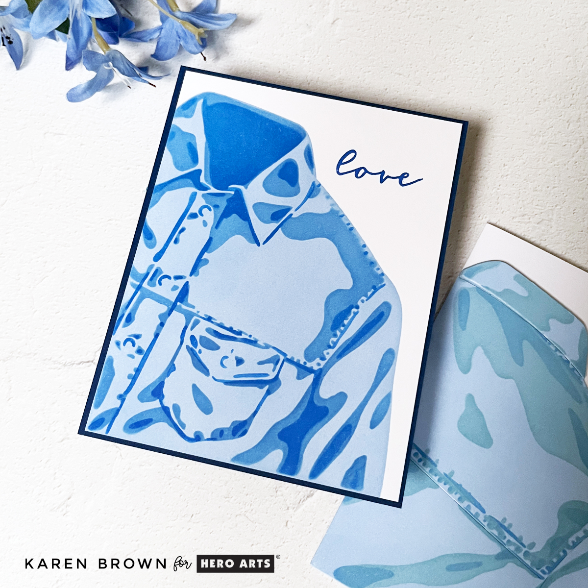 One-layer masculine card featuring a stenciled blue jean jacket front using layered blue inks on white cardstock with a clean background and stamped love sentiment.