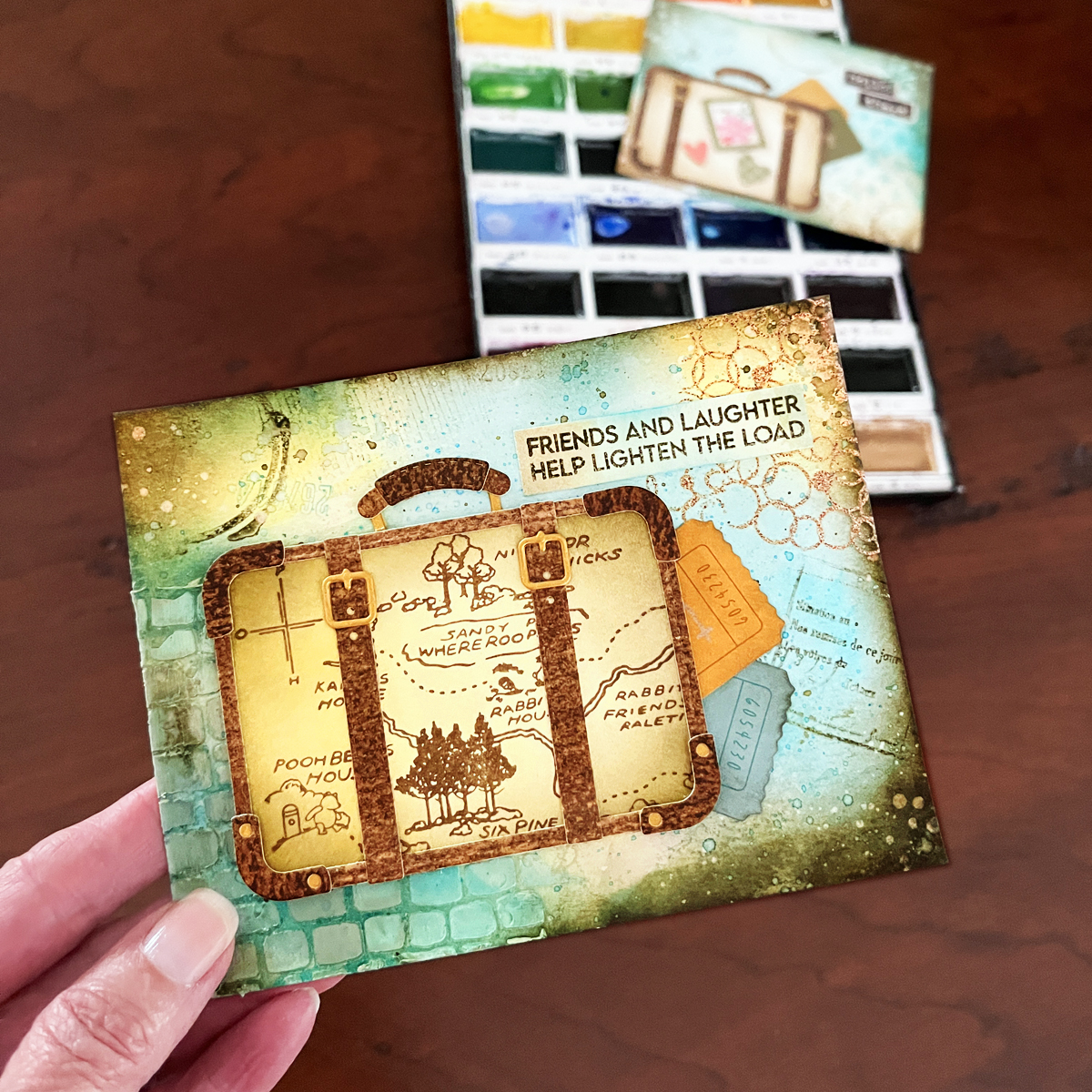 Vintage look mixed media card with watercolor background that features Spellbinders Retro Suitcase die SDS-221