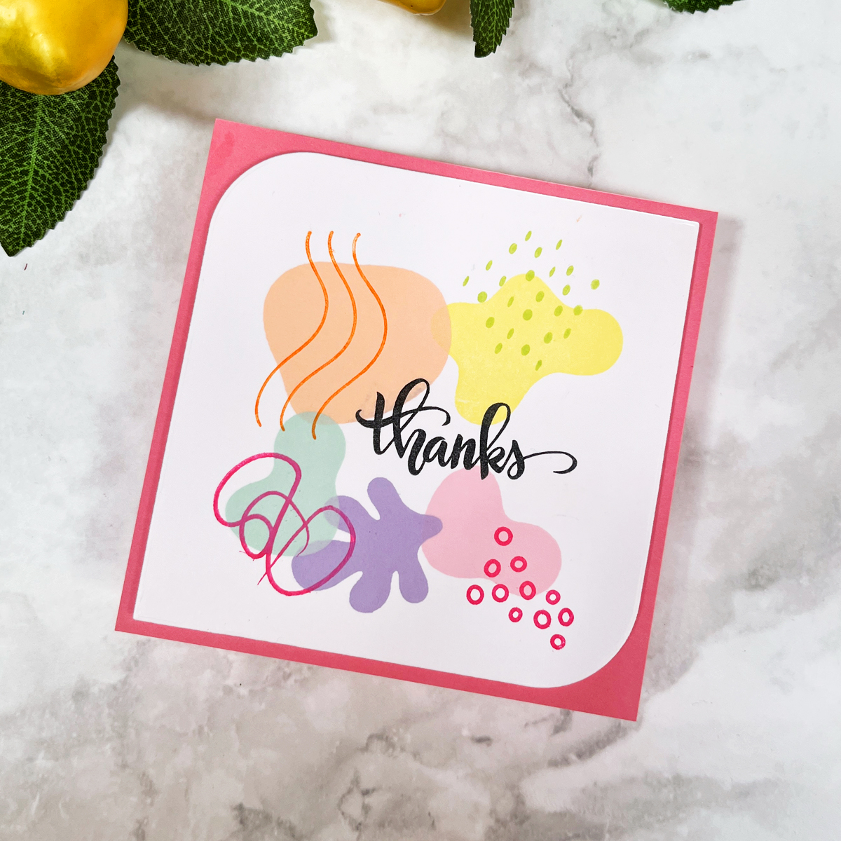DIY thank you note with organic absract stamped shapes in fruity rainbow colors.