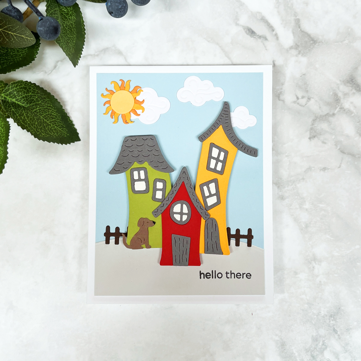 Village die cut scene card with whimsical houses.