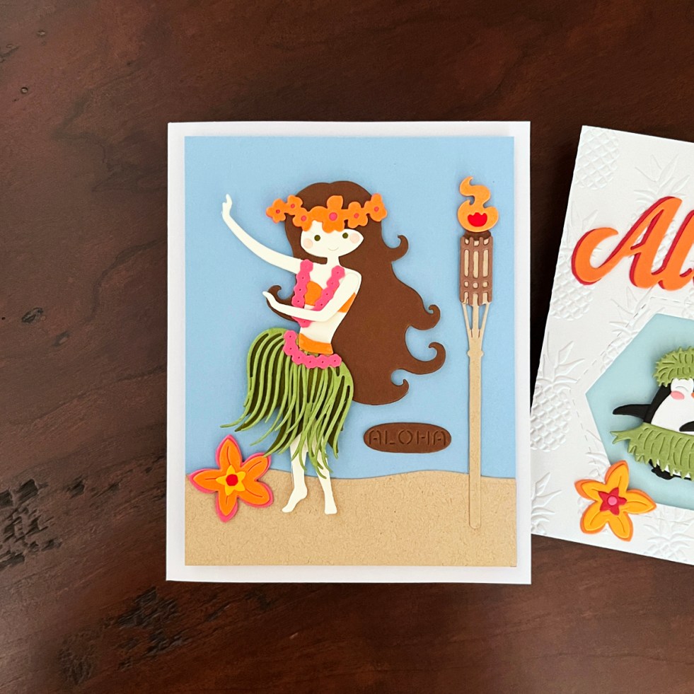 die cut scene card featuring an adorable hula dancer on the beach
