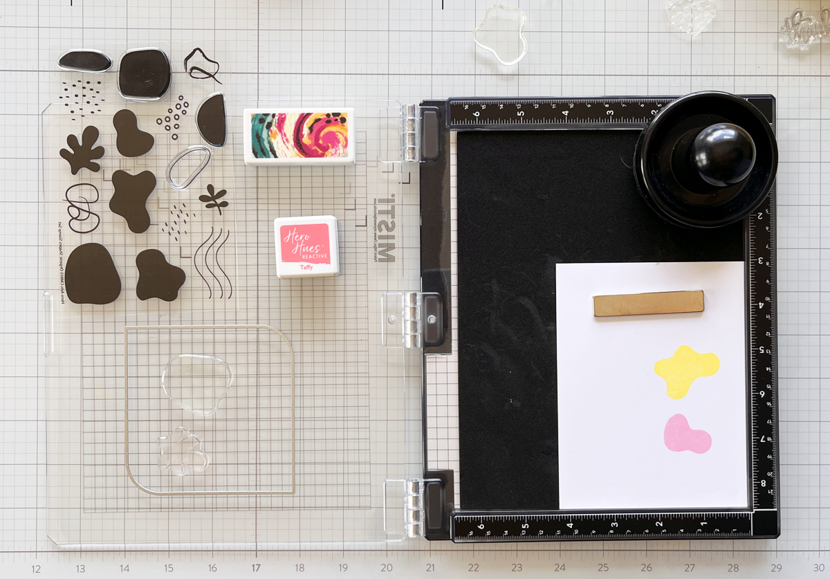 Black MISTI stamping platform with Organic Shapes stamps and colorful stamping in progress.