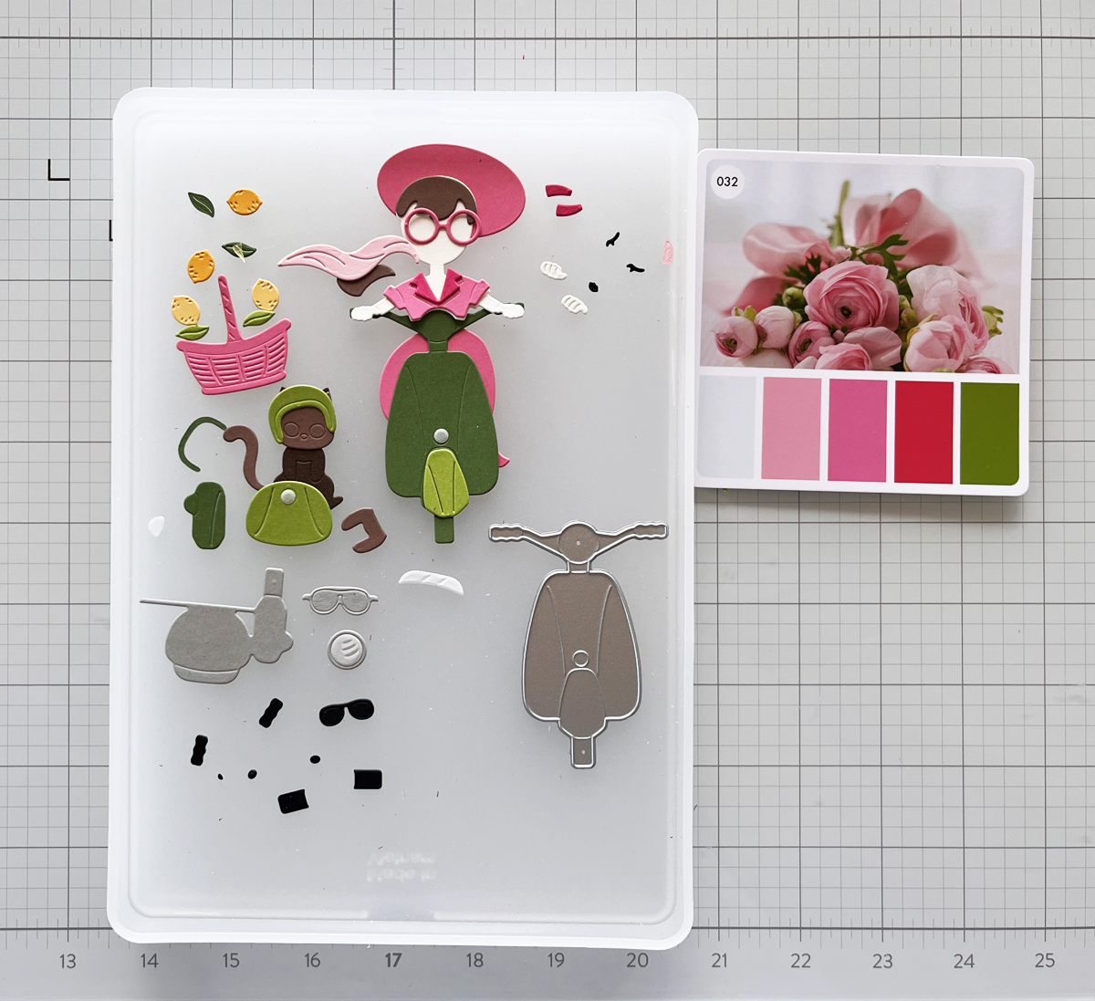 Scooter and sidecar die-cut pieces organized in a Craft Stax container before assembly.