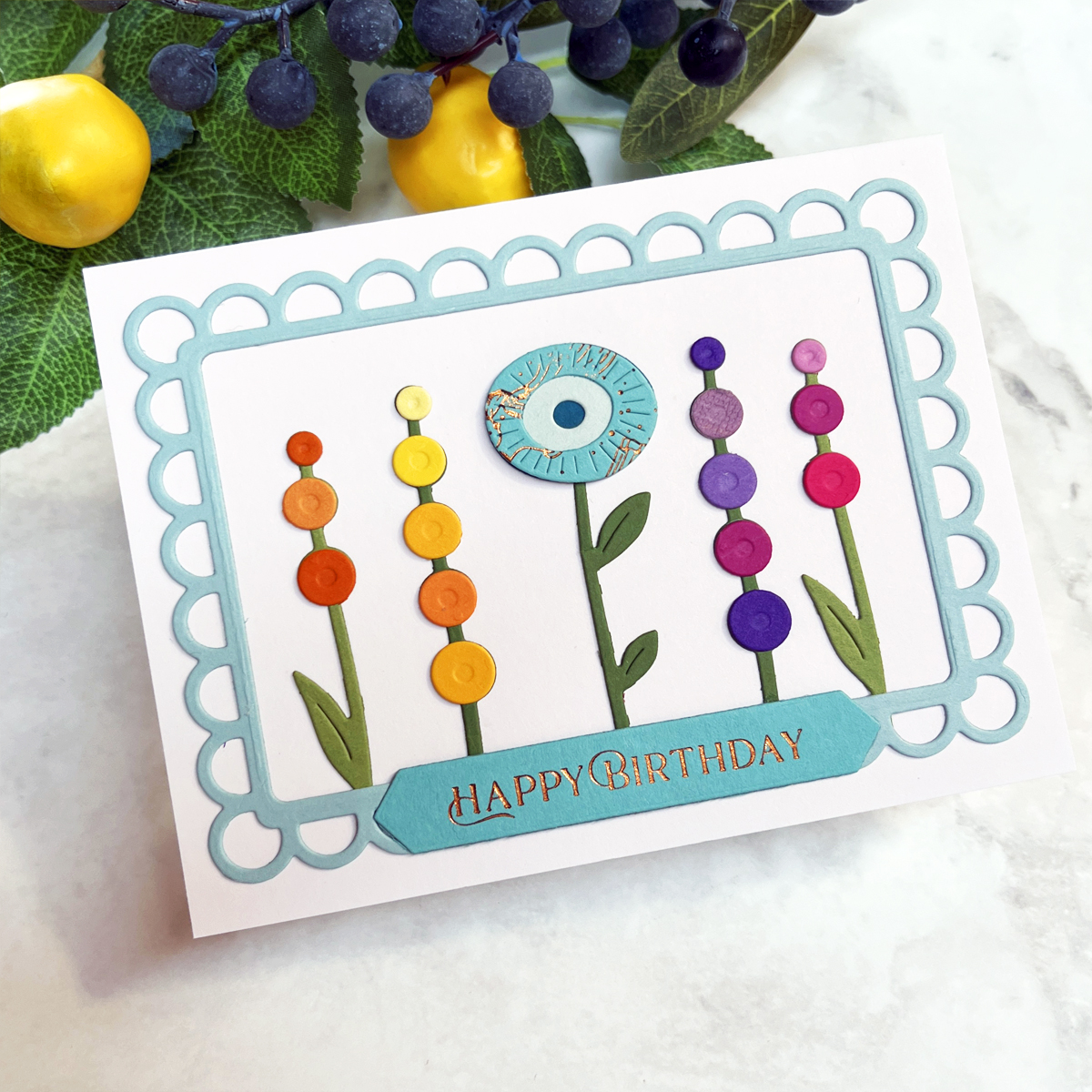 Rainbow floral birthday card featuring Spellbinders Whimsical Blooms dies arranged inside an elegant Open Lace Frame with colorful die-cut flowers and layered dimension.