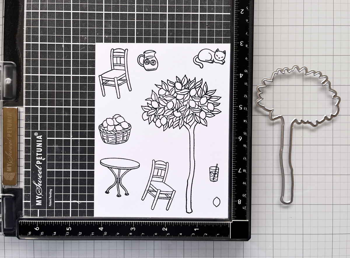 Stamped lemon tree scene positioned inside a MISTI stamping platform before coloring.