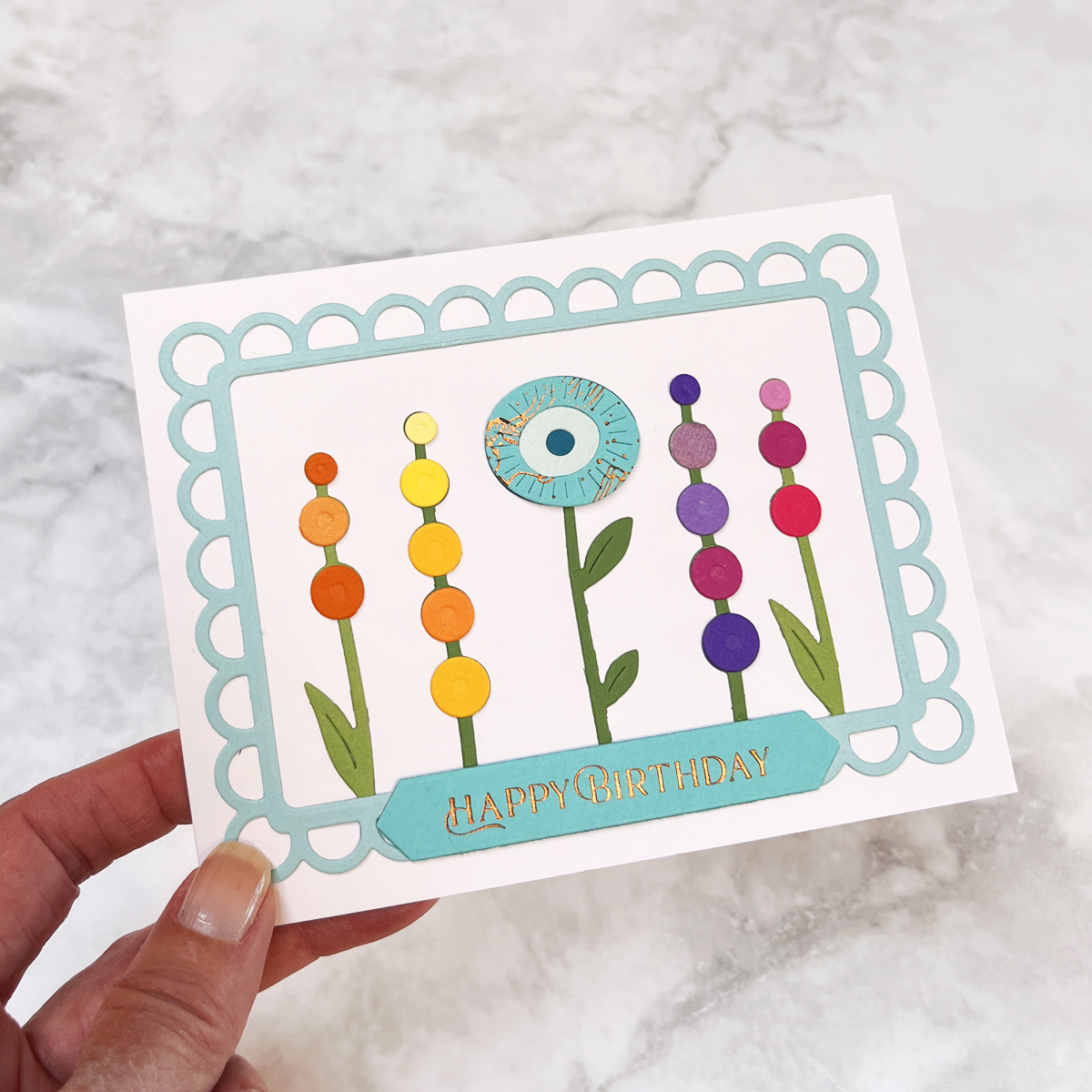 Whimsical floral birthday card in rainbow colors finished off with the Open Lace Frame and a foiled sentiment