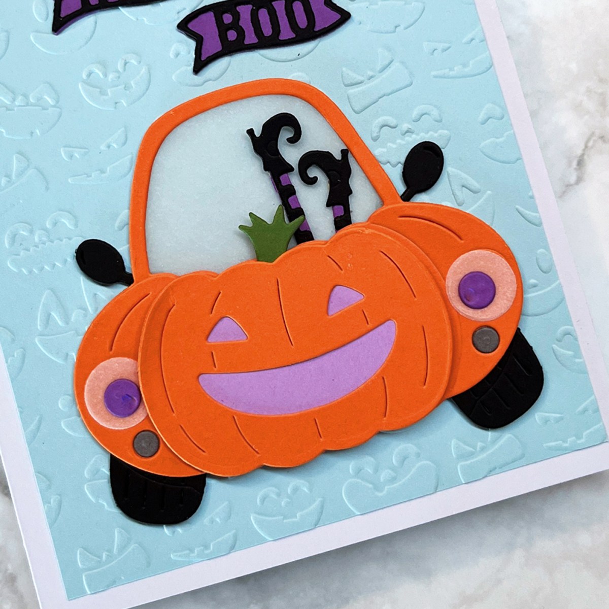 Die cut pumpkin car with an embossed background on a handmade card