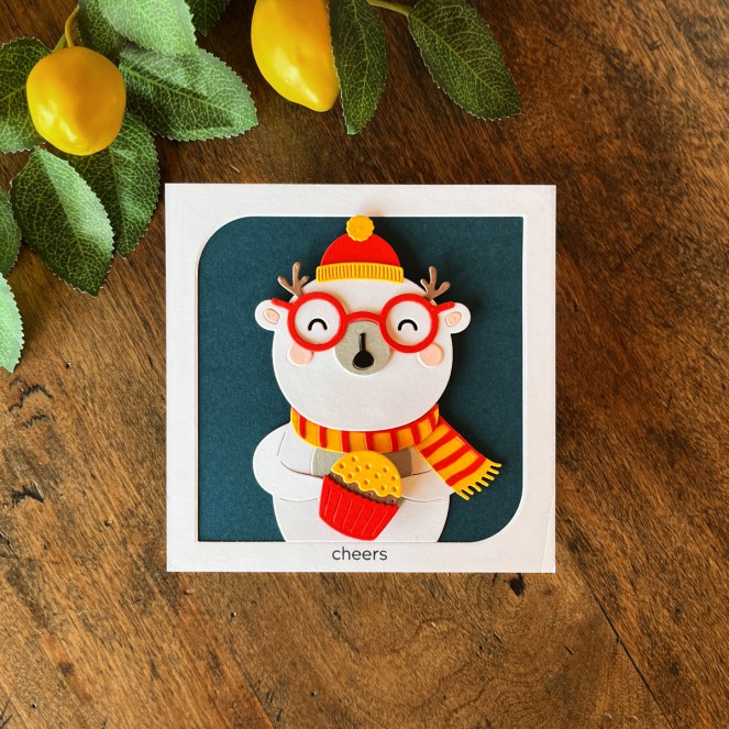 interactive Christmas card featuring a cheerful polar bear with a spinning cupcake.