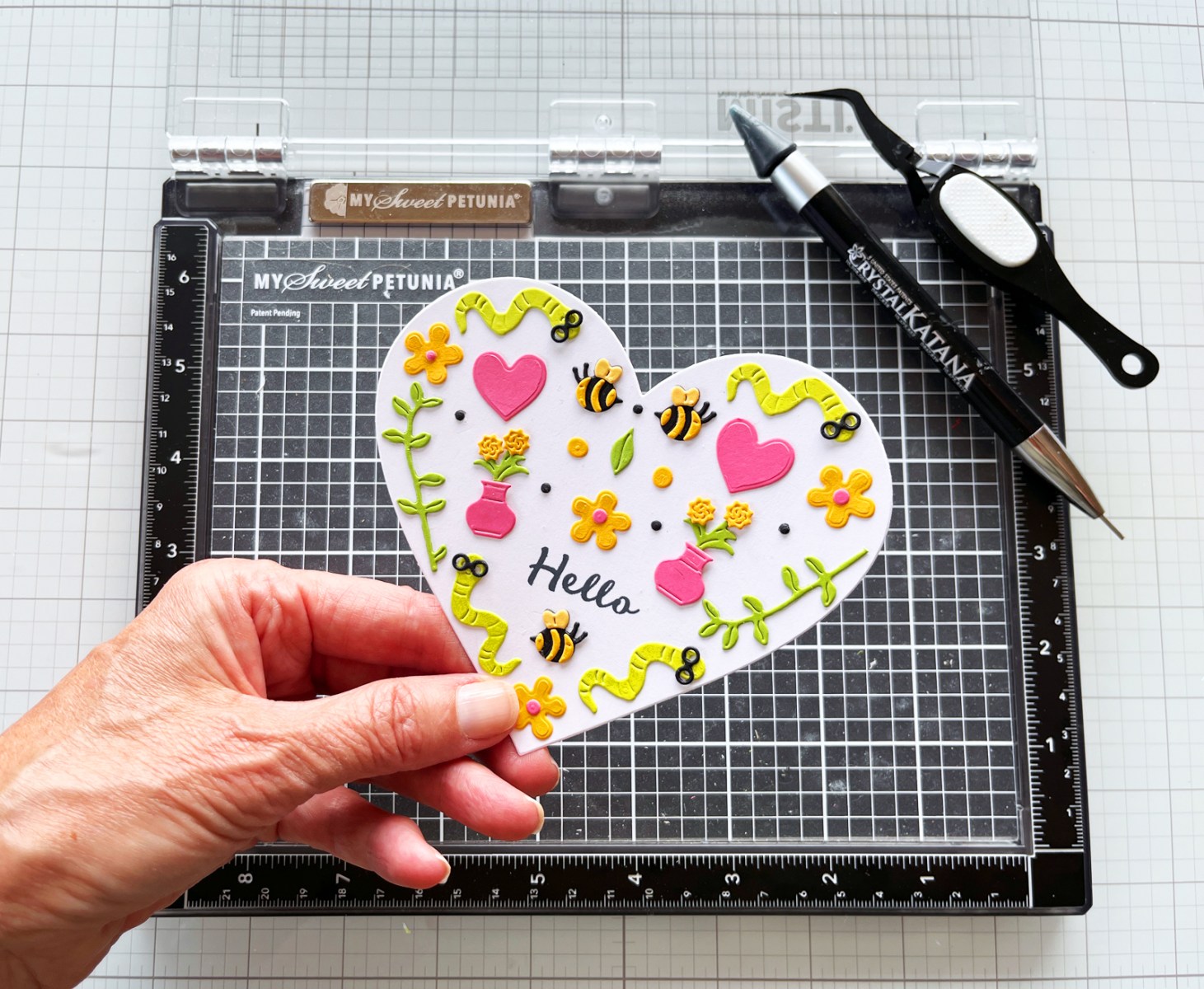 Karen working on a handmade card at her craft table
